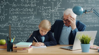 Teacher helping a student at a desk
